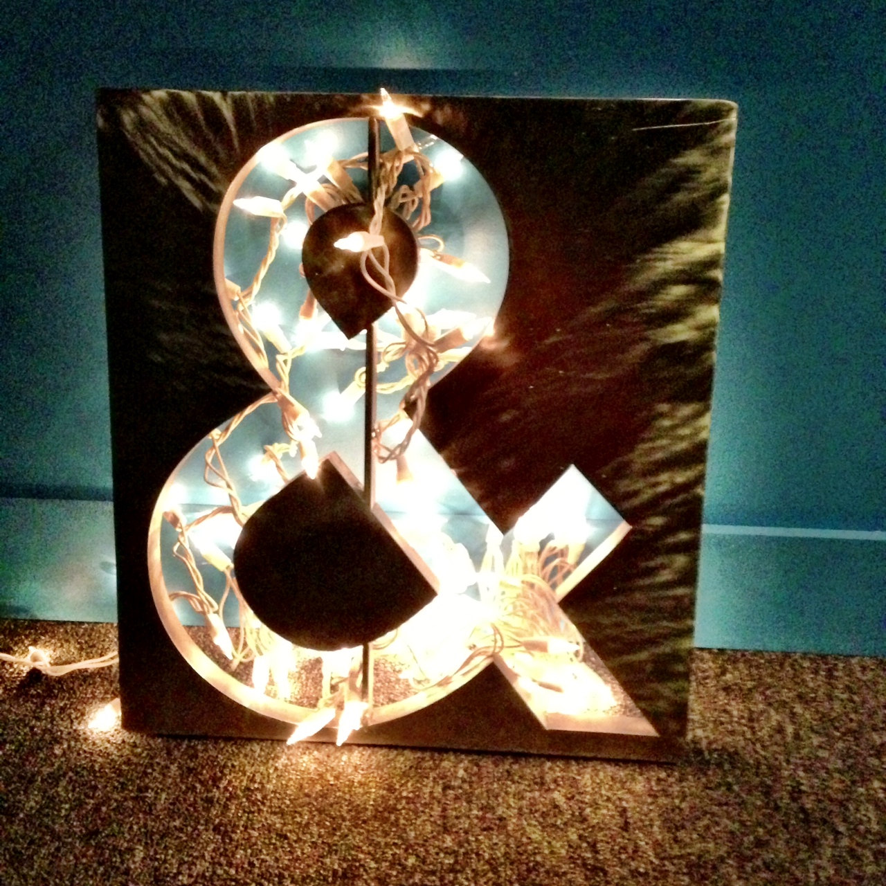 an ampersand decorated with lights